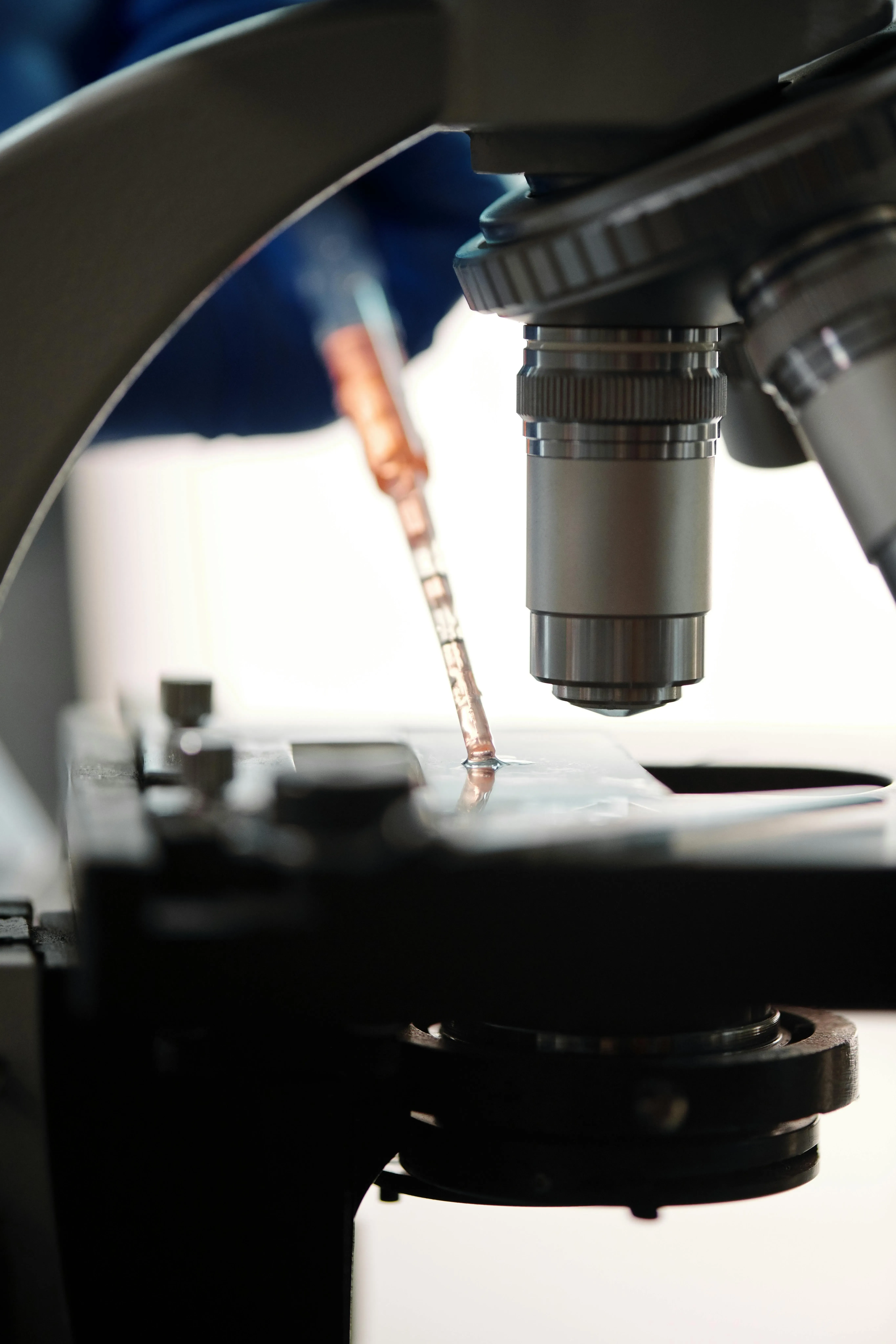 Microscope at work in a genetic medicines research lab